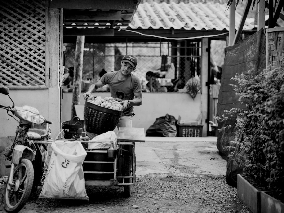 a person on a motorcycle in front of a house