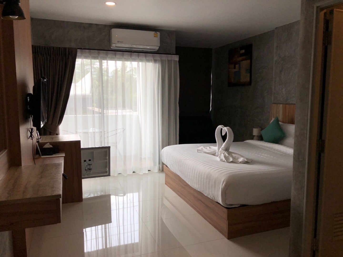 a bedroom with a large mirror