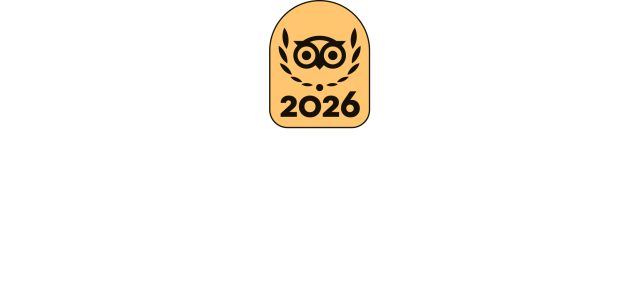 2026 emblem with an owl and laurel design on a beige background.